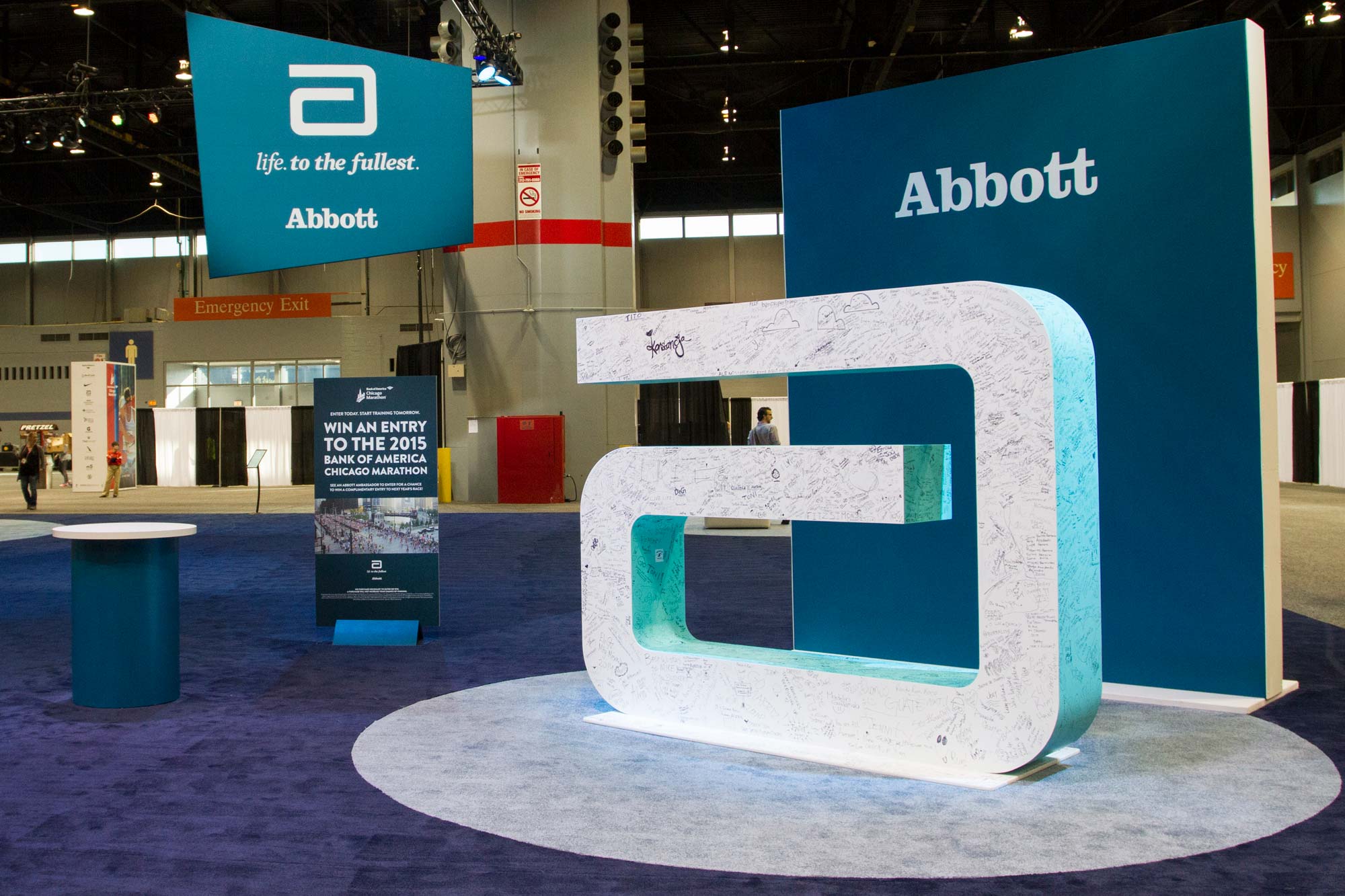 Huge Abbott logo installation that people signed in the pavilion