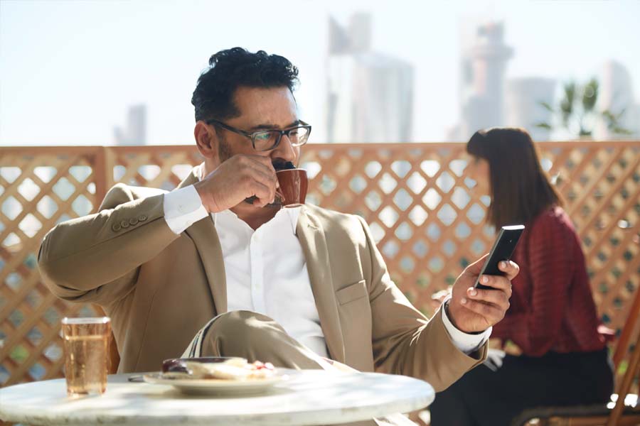 business man checking shipment status on mobile phone
