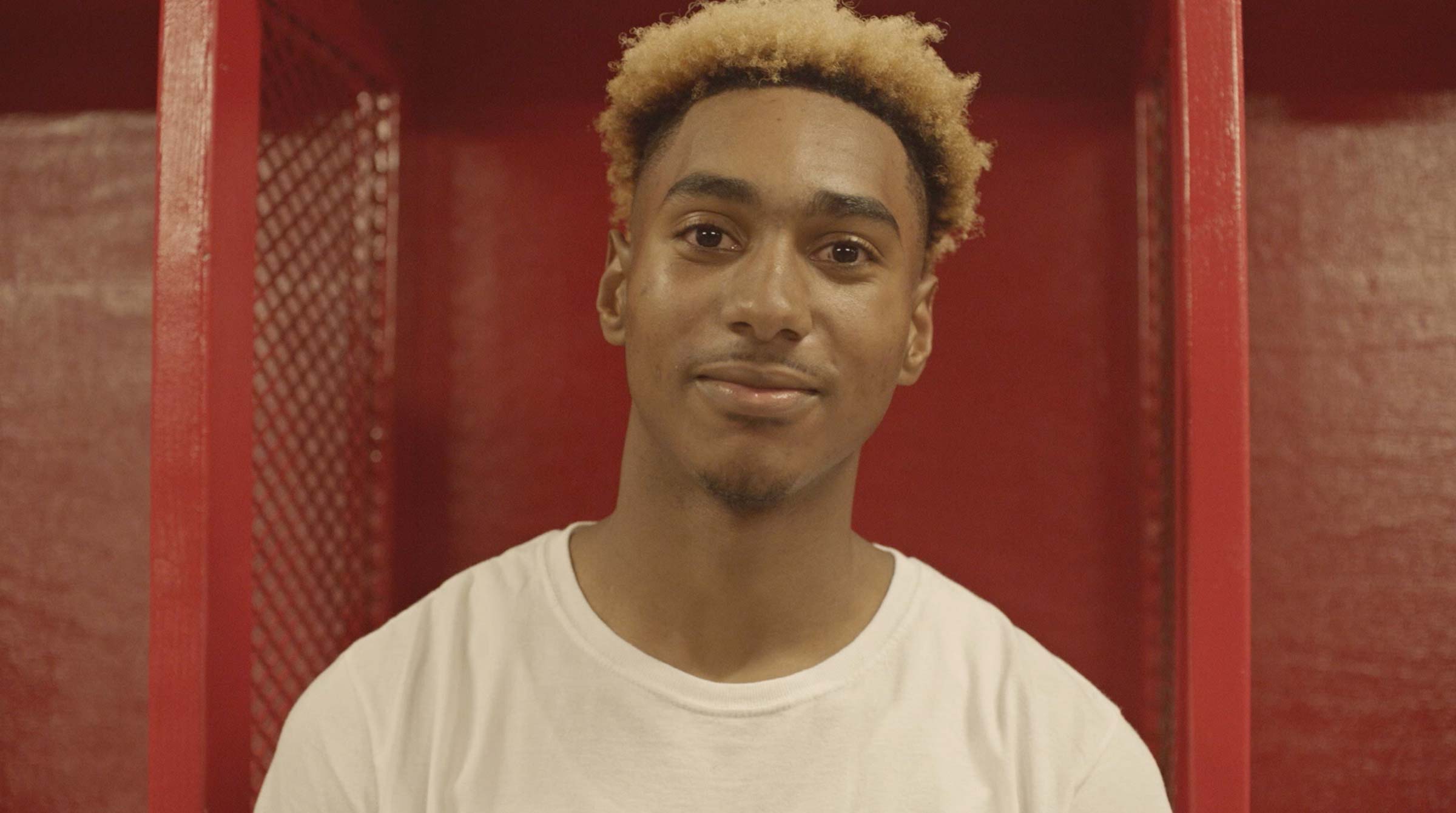 Glen Oaks High School football player at his new locker